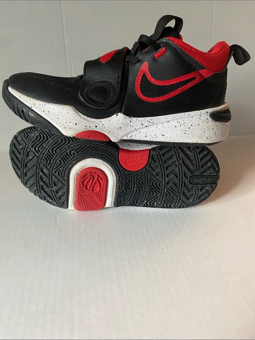 Nike Team Hustle D 11 Big Kids Black and Red High-Top Sneakers